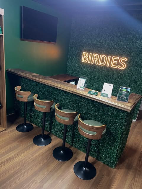 Commercial bar fit-out with timber bar top and timber-look flooring